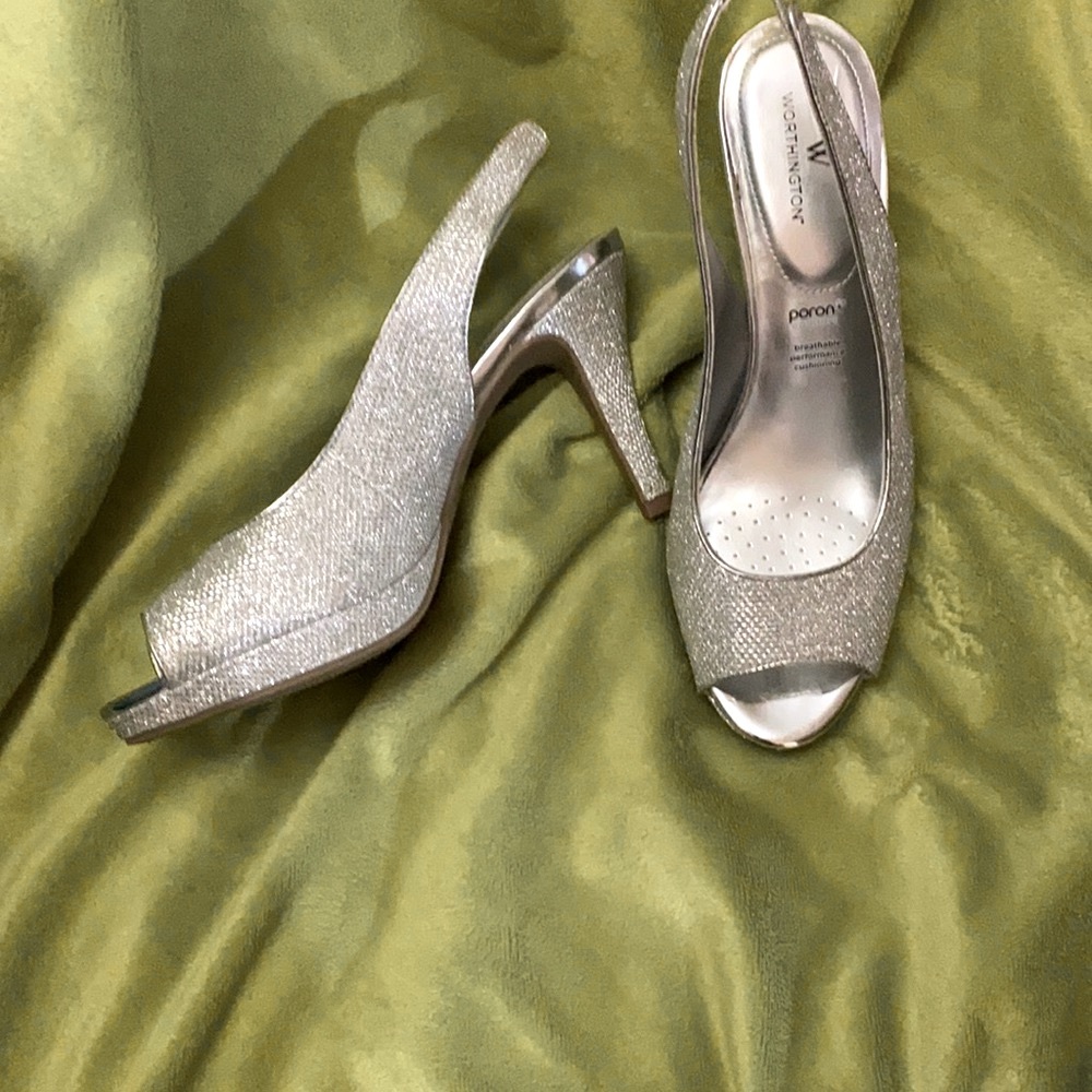 Rhinestone studded open toe sling back heels.